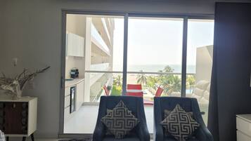 Apartment, Sea View | Living area | Flat-screen TV