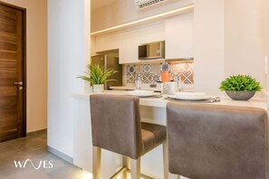 Condo, 1 King Bed with Sofa bed, Pool Access, Pool View (The Gallery N310) | Private kitchen | Coffee/tea maker