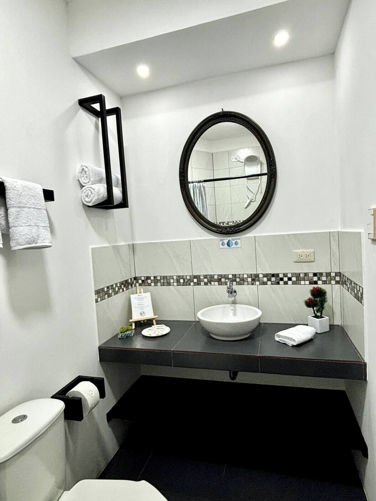 Shower, hair dryer, towels, soap