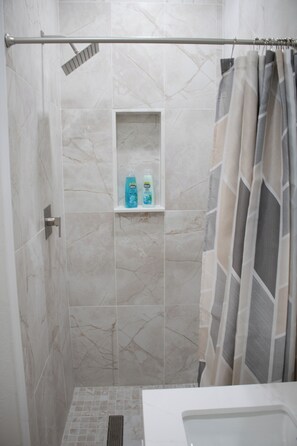 Shower, towels, soap, toilet paper