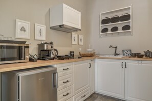 Fridge, microwave, stovetop, coffee/tea maker