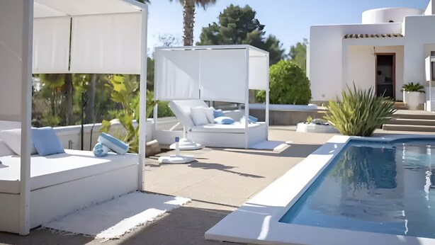 A modern outdoor pool area with white lounge chairs and a small pool. - Villa 'Can Americano, 4 with Mountain Views, Wi-Fi and Air Conditioning (Illes Balears)