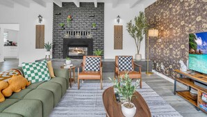 TV, fireplace, books, stereo - New Themed Coastal 4Bed w/ Pool/Arcades/Foosball (Montara)