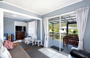 TV, fireplace, DVD player, stereo - Okiwi Bay Bach with Bay Views (Okiwi Bay)