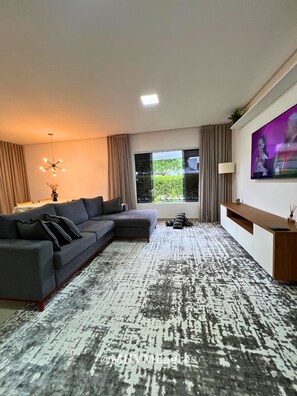 Villa | Living area | 55-inch flat-screen TV with digital channels, TV