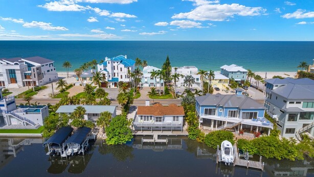 A coastal residential area with houses, a marina, and a beach. - Beach Dayz | Walk to Beach, Restaurants, Boat Dock & More (Bonita Springs)