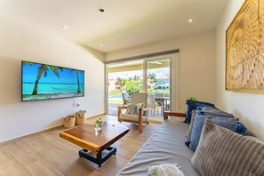 Deluxe Apartment, 2 Bedrooms, Lake View, Ground Floor | Living area | 65-inch LCD TV with digital channels, Netflix, streaming services - Lagoon Front Infinity Pool Paddleboard And Fun Puerto Aventuras (Puerto Aventuras)