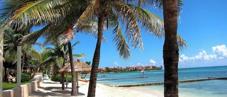 Beach nearby, white sand, sun loungers, beach umbrellas