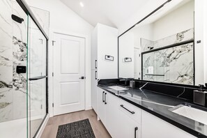 Shower, hair dryer, towels, soap