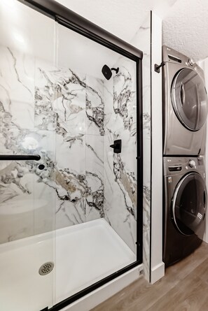 Shower, hair dryer, towels, soap