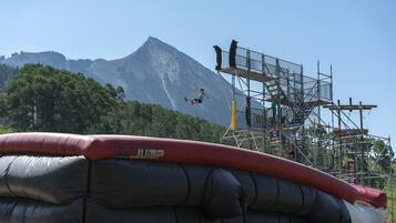 A bungee jump platform with a mountainous backdrop.
