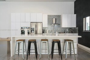 Fridge, microwave, oven, stovetop - Glamorous Waterfront Canal Home w/ Pvt Dock & Pool (Fort Lauderdale)