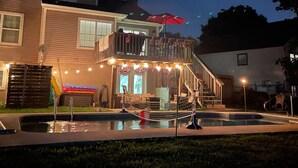 A house with a pool, a deck, and a staircase leading to a balcony. - NEW LISTING! Home with a POOL, PARK, and close to Arrowhead & Kauffman! (Blue Springs)