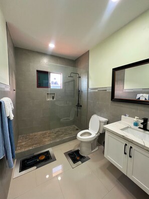 Shower, jetted bath, towels, soap