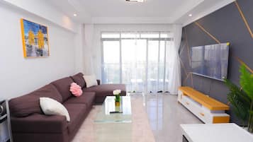 Apartamento Deluxe, vistas a la ciudad | Zona de estar
