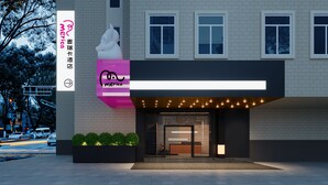 A modern building with a large sign for 'merica' and a smaller sign for 'sugar maple accommodation'. - Merica Hotel -Chengdu Chunxi Road (Chengdu)