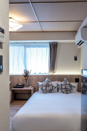 Quarto duplo, 2 camas de casal, para não fumantes | Cortinas blackout, Wi-Fi de cortesia