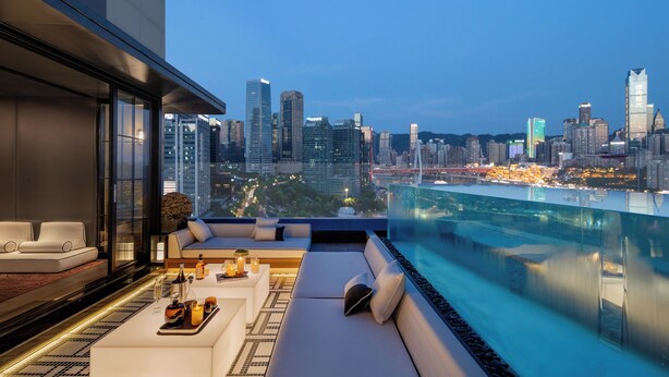 A rooftop lounge with a city view, modern furniture, and a pool. - INDITION Chongqing Jiangbeizui Financial (Chongqing)