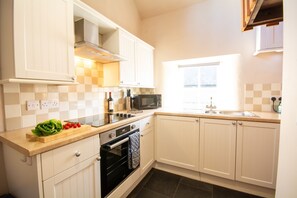 Fridge, microwave, toaster, dining tables