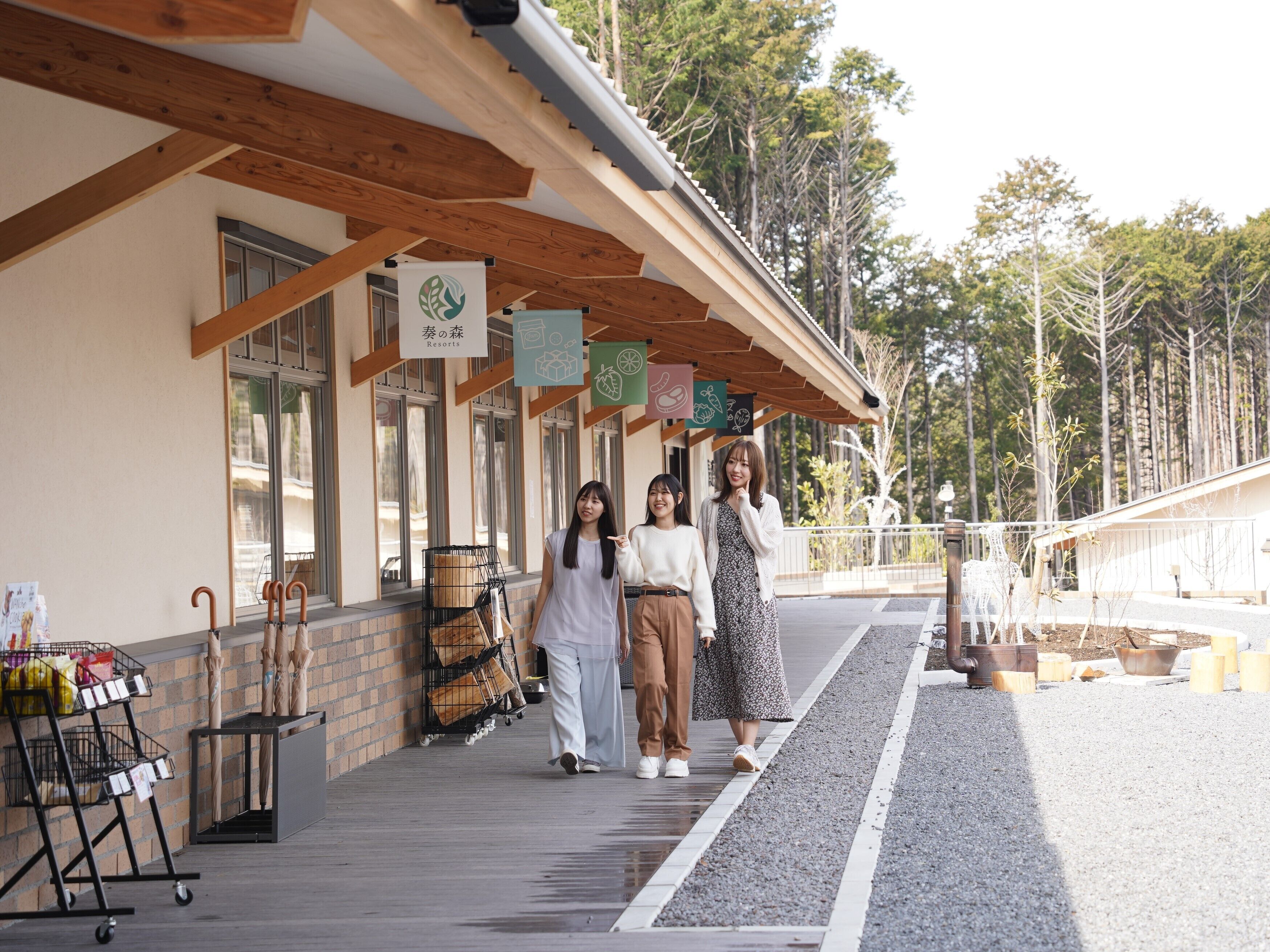 A building with a covered walkway, wooden beams, and a sign indicating a resort.