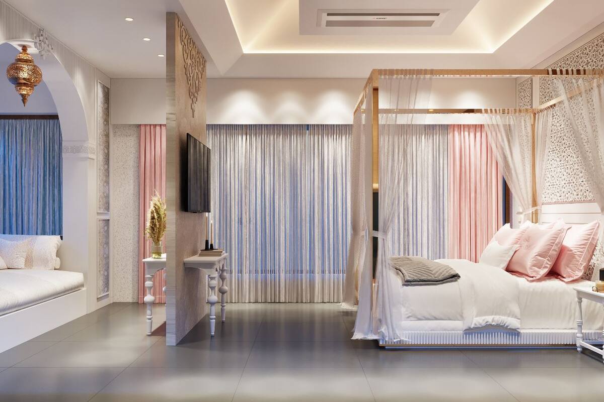 A modern bedroom with a canopy bed, a flat-screen TV, and a decorative wall panel.