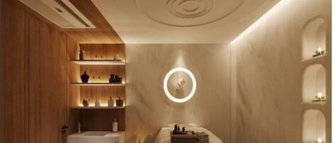 A spa room with a wooden floor, a massage table, and a ceiling with circular light fixtures.