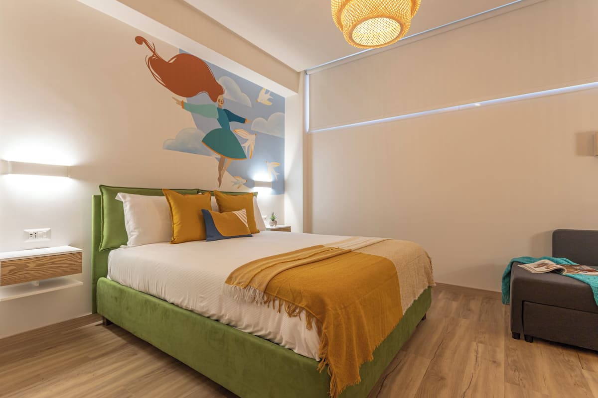 Family Triple Room (Danza Suite) | Individually furnished, desk, laptop workspace, blackout drapes