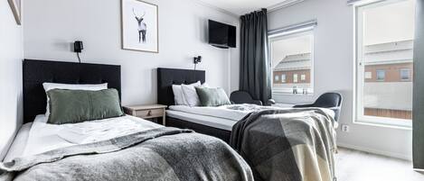 Desk, laptop workspace, blackout drapes, soundproofing