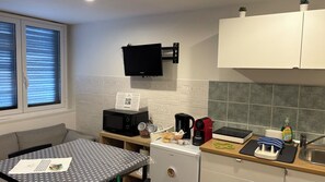Fridge, microwave, electric kettle, cookware/dishes/utensils