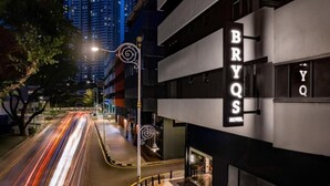 A modern hotel with a prominent sign reading "BRYO'S HOTEL." - BRYQs Hotel Kuala Lumpur (Kuala Lumpur)