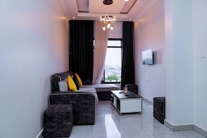 Apartment, Balcony, City View | Living area | Smart TV, printers - Martin Aviator Apartment (Kigali)