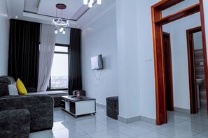 Apartment, Balcony, City View | Living area | Smart TV, printers - Martin Aviator Apartment (Kigali)
