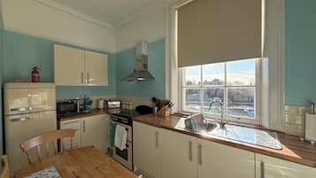 Standard Apartment, 1 Double Bed with Sofa bed, City View | Private kitchen | Electric kettle, toaster, dining tables
