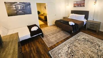 1 bedroom, desk, iron/ironing board, travel crib