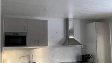 Apartment | Private kitchen | Full-size fridge, microwave, oven, stovetop