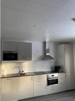 Apartment | Private kitchen | Full-size fridge, microwave, oven, stovetop