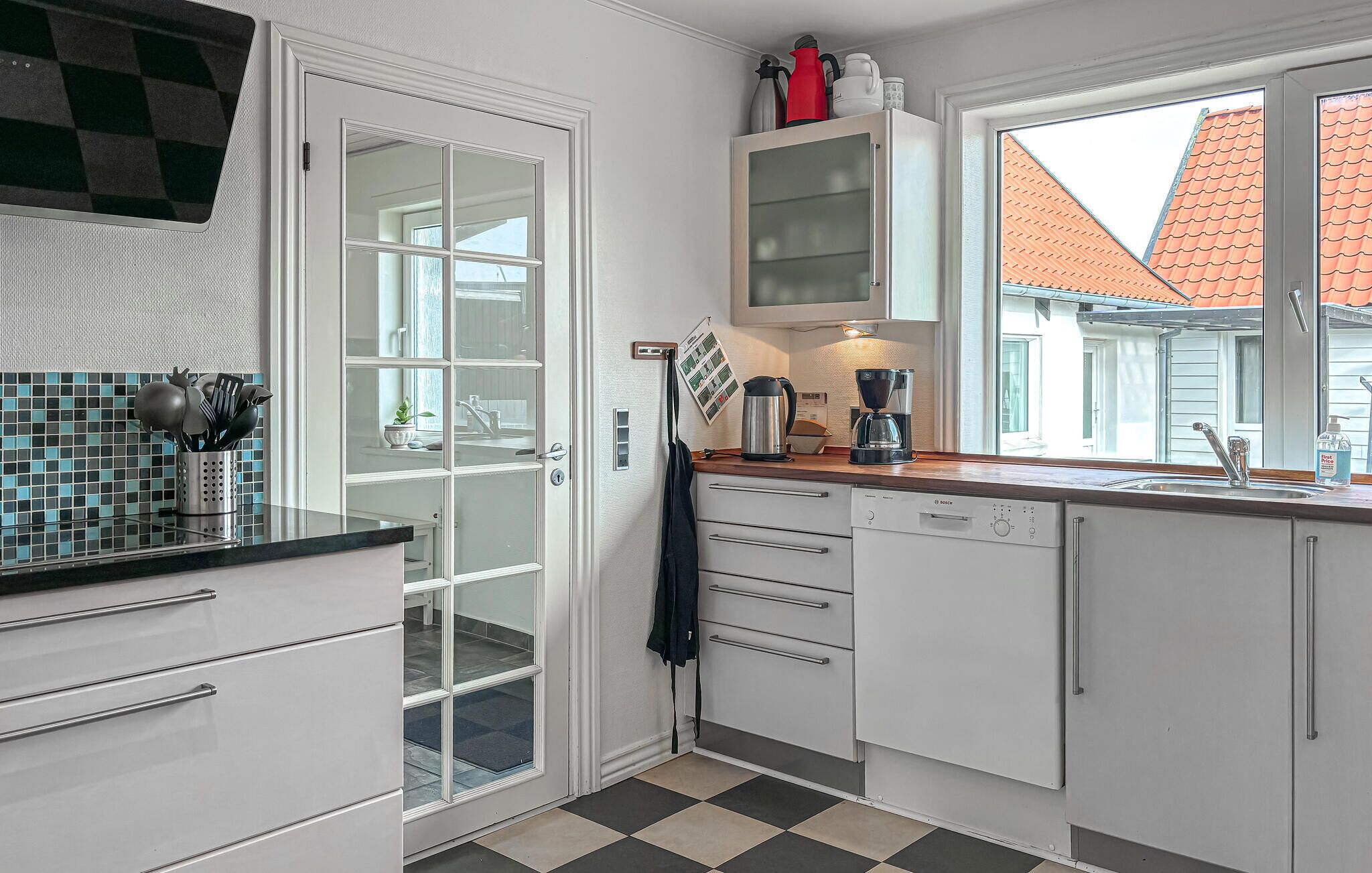 Fridge, stovetop, dishwasher, coffee/tea maker