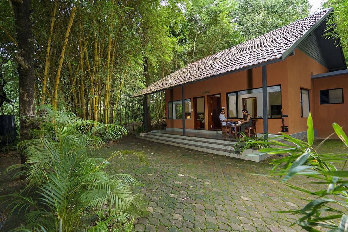 A building with a tiled roof and a covered patio area.