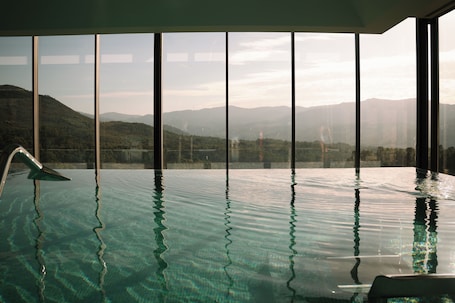 Indoor pool, pool umbrellas, sun loungers