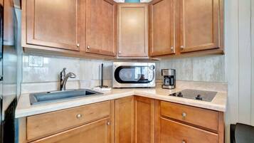 Fridge, microwave, stovetop, coffee/tea maker