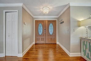 Step inside to gleaming hardwood floors and an elegant chandelier that casts a warm, welcoming glow. The stylish entryway sets the tone for a home designed with your comfort in mind. - BBQ & Pool Day! Large 4B 12 minutes to the Beach! (Largo)