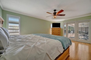 Wake up in your serene bedroom and step directly out to your private patio through elegant glass doors—perfect for morning coffee under the gentle breeze of your ceiling fan. - BBQ & Pool Day! Large 4B 12 minutes to the Beach! (Largo)