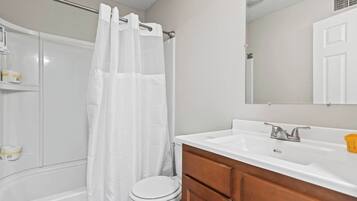 Shower, hair dryer, towels, shampoo