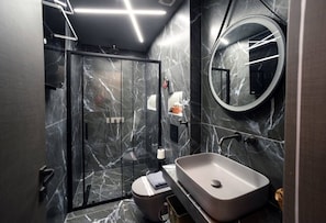 Shower, hair dryer, towels, soap