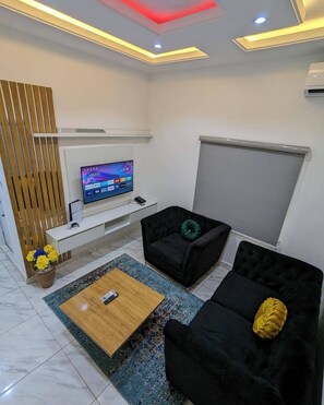 Junior Apartment, Balcony, City View | Living area | Flat-screen TV - Westpark Luxury Apartment (Lagos)