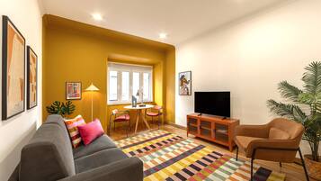 Una Smart TV, libros, una pantalla de ordenador