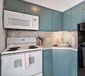Fridge, microwave, stovetop, coffee/tea maker