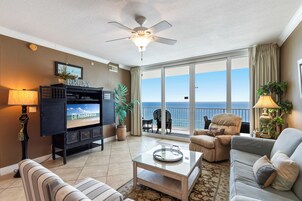 Deluxe Condo, 2 Bedrooms, Balcony, Beach View | Living room | 50-inch Smart TV with cable channels