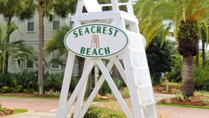 A sign for Seacrest Beach with a white chair structure. - ☀️30A Private Beach Access-Pool-Inn at Seacrest 309- Somewhere in the Sun☀️ (Inlet Beach)