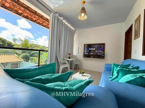 Villa | Living area | 32-inch flat-screen TV with digital channels, TV